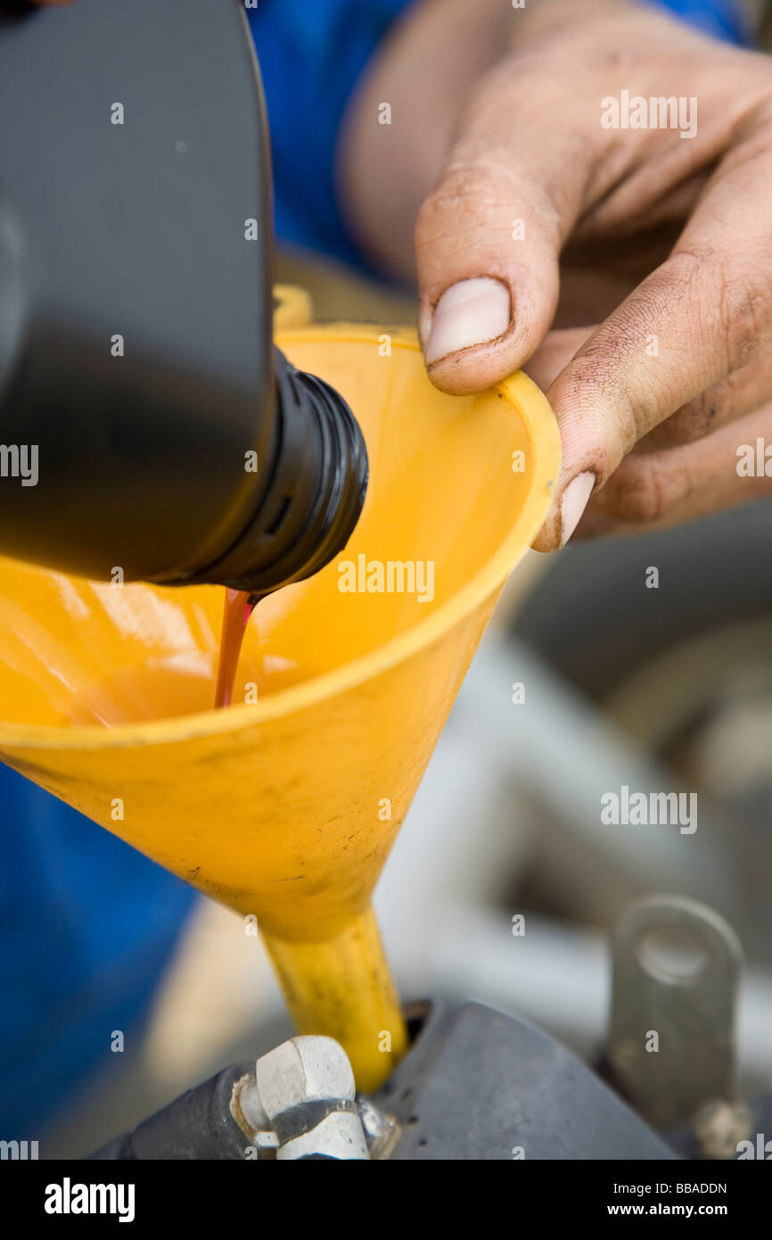 Pouring liquid through a funnel Stock Photo Alamy