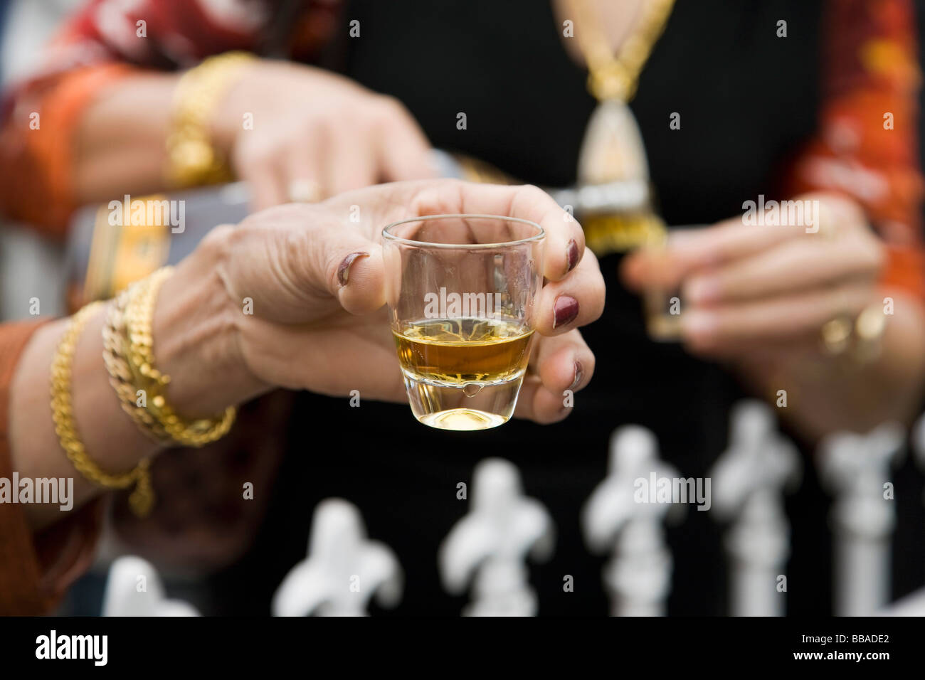 Hands holding drinks at a social gathering Stock Photo Alamy