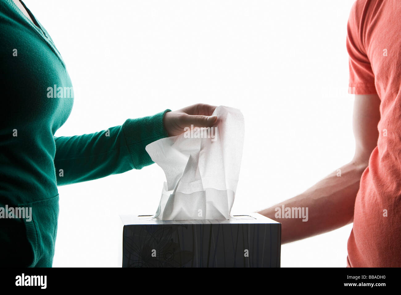 Two people with a box of tissues, midsection Stock Photo