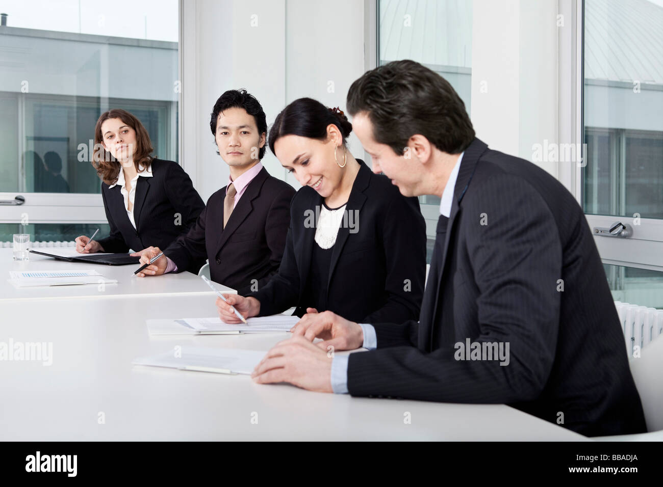 Four business people in a business meeting Stock Photo - Alamy