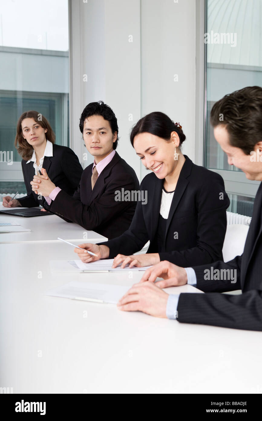 Four business people in a business meeting Stock Photo - Alamy