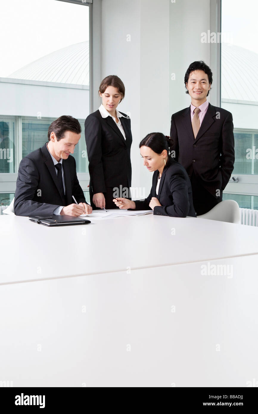 Four business people in a business meeting Stock Photo - Alamy
