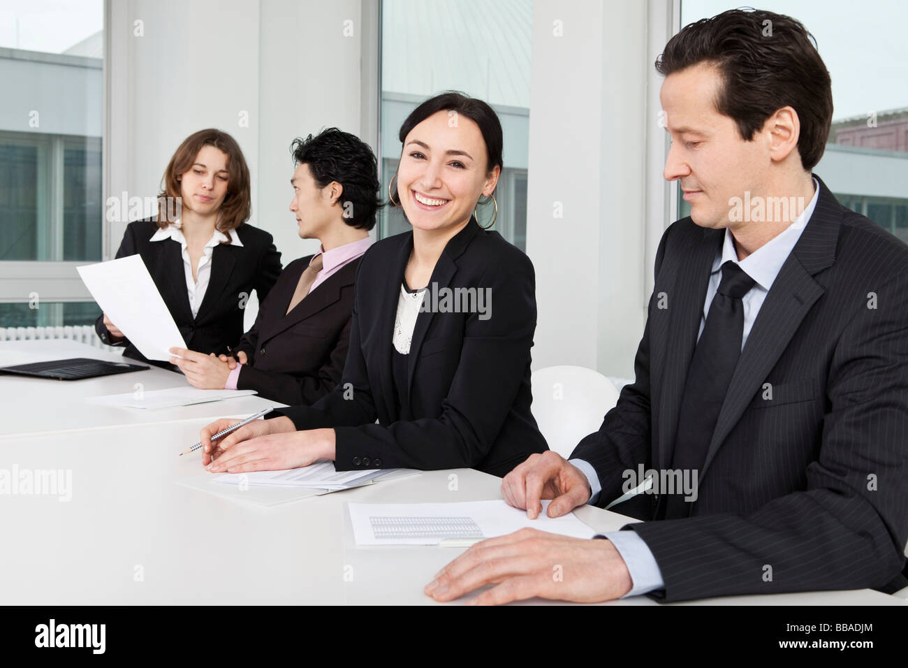 Four business people in a business meeting Stock Photo - Alamy