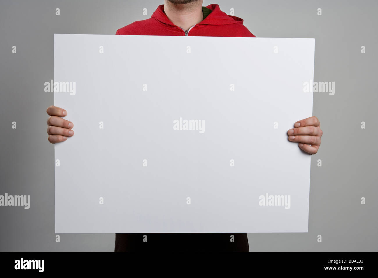 A man holding a blank sign Stock Photo