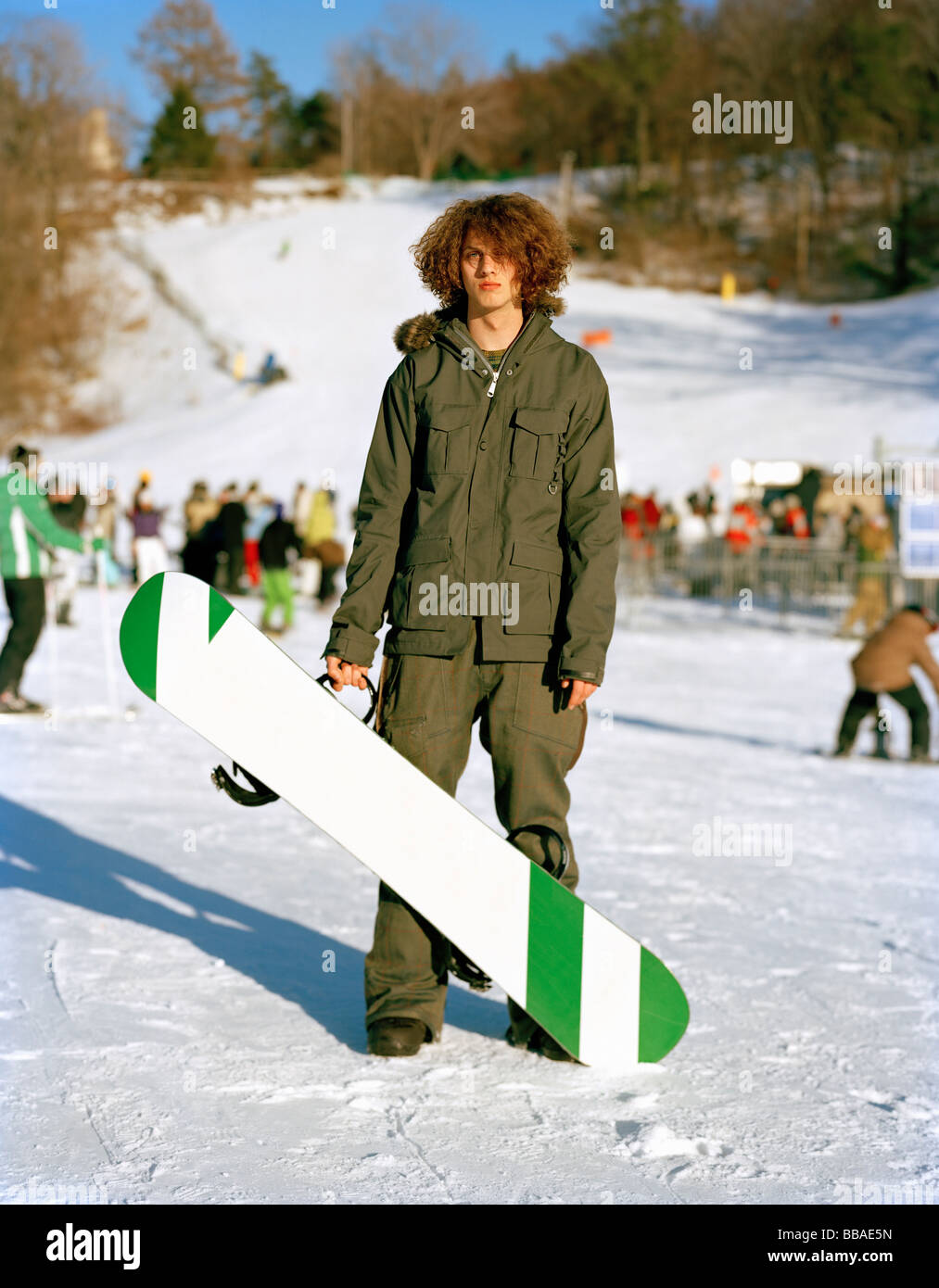 A young man standing with a snowboard at a ski resort, Mountain Creek, New  Jersey, USA Stock Photo - Alamy