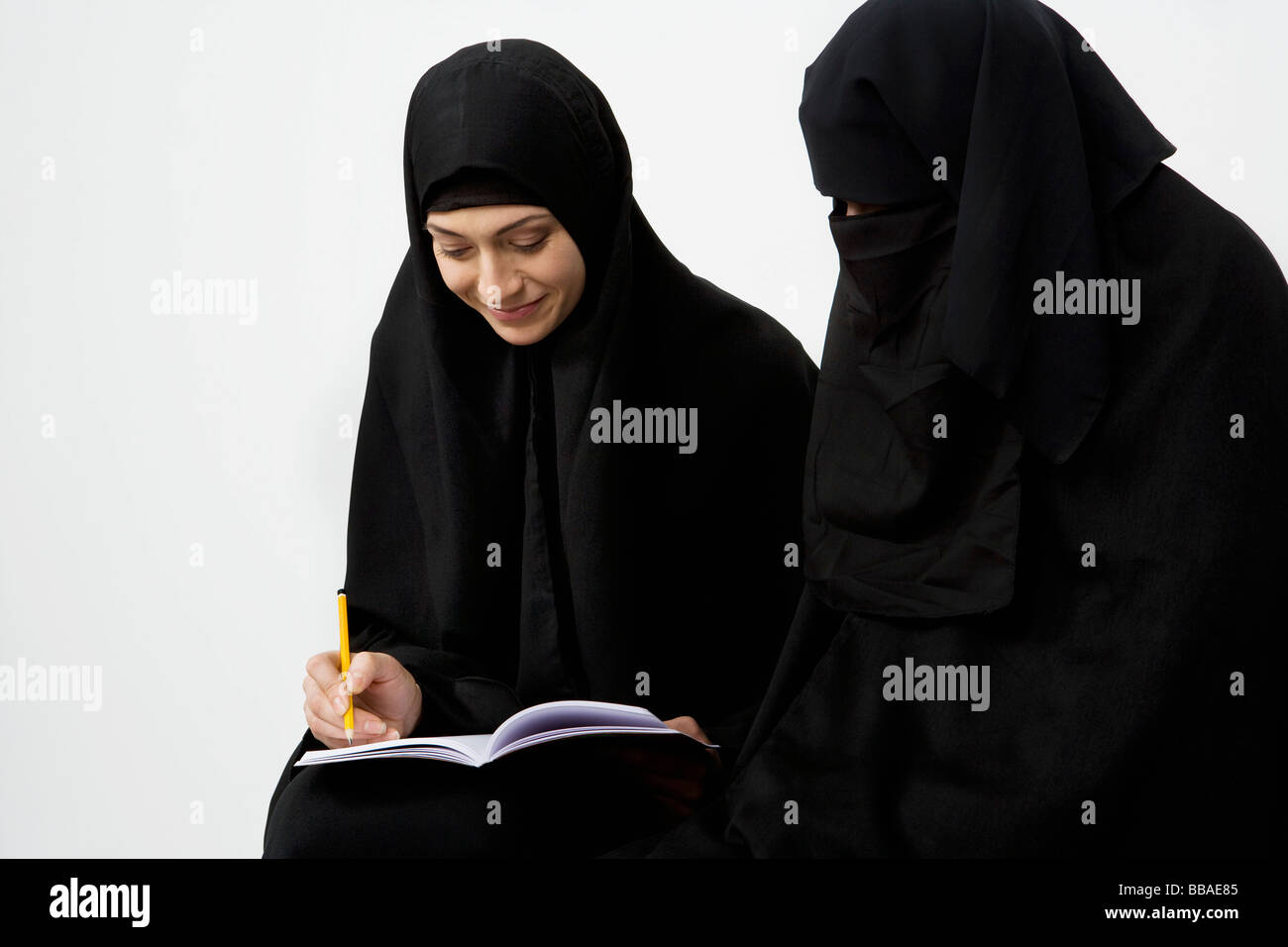 Two women wearing traditional Muslim clothing Stock Photo