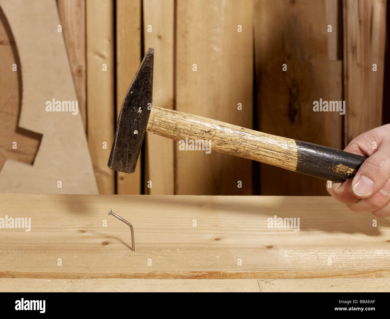 A hammer above a bent nail Stock Photo