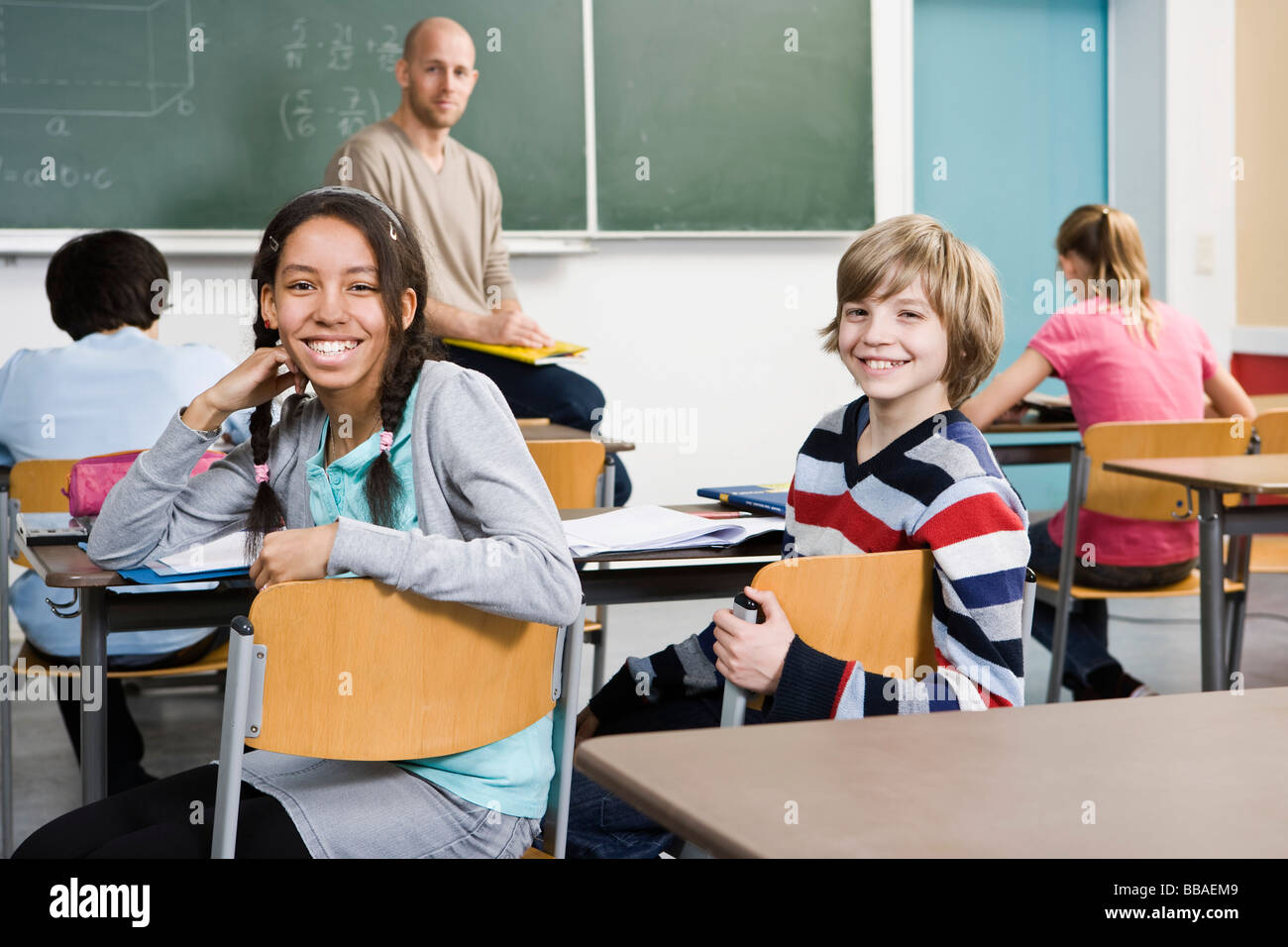 Two school children sitting in a classroom Stock Photo Alamy