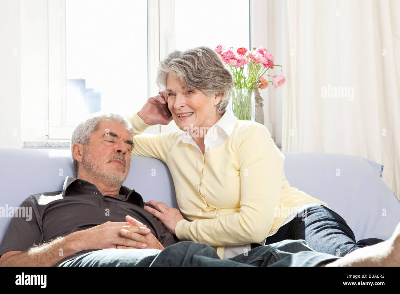 A senior couple on a couch Stock Photo