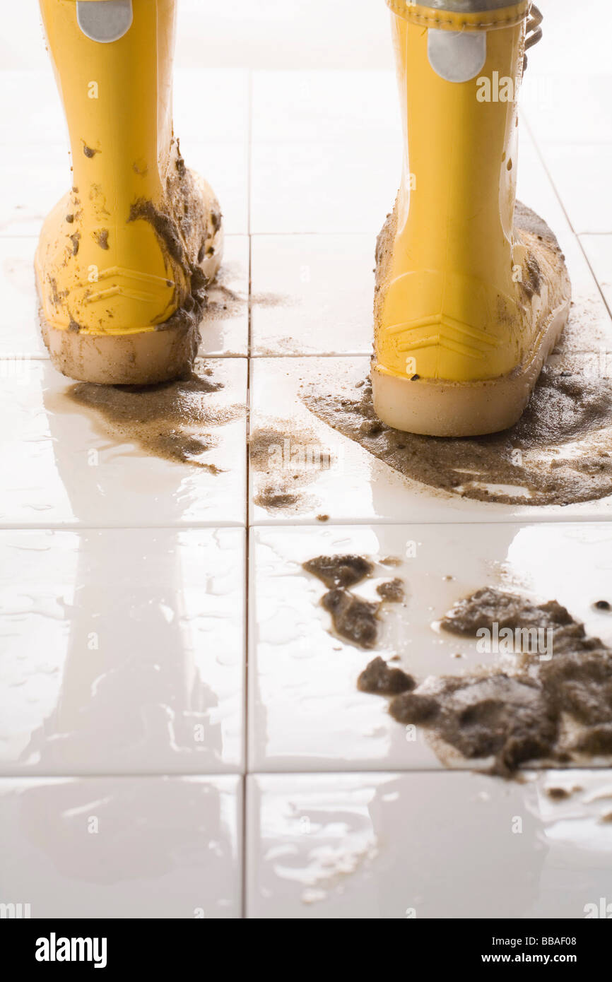 A pair of muddy rubber boots Stock Photo Alamy