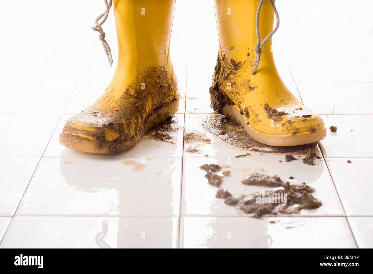 pair of muddy rubber boots Stock Photo 