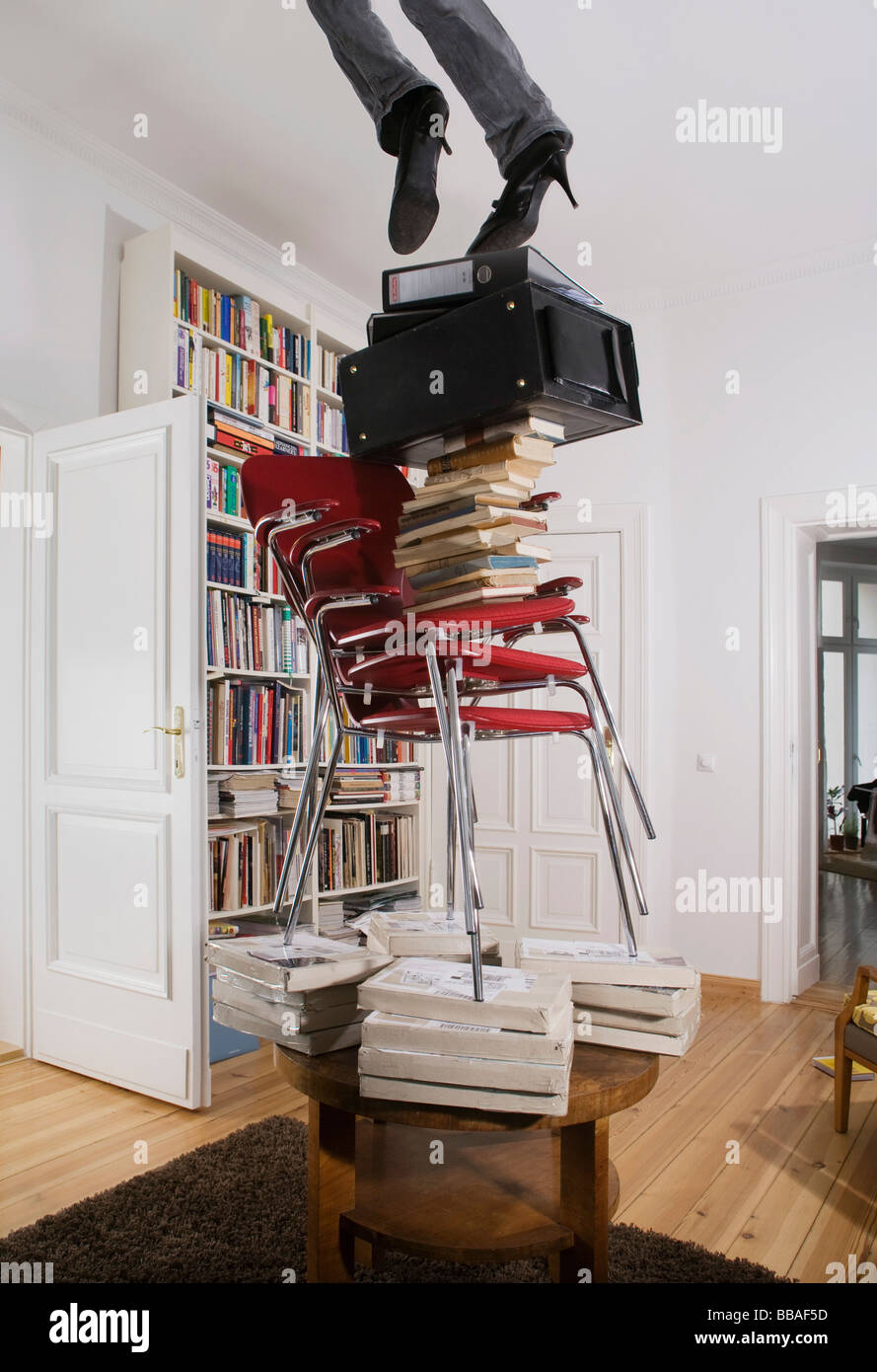 A woman falling off a stack of objects, low section Stock Photo