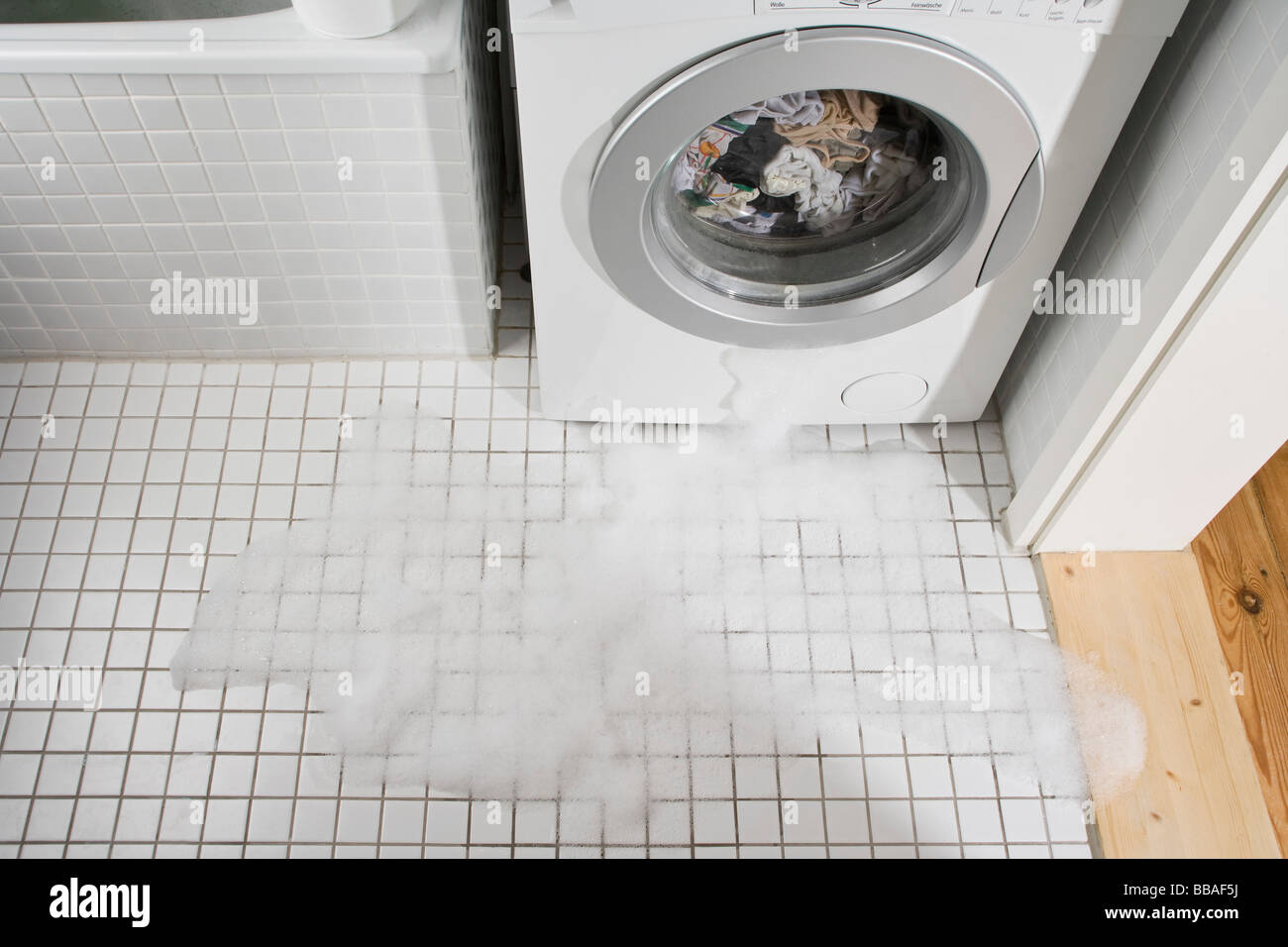 A leaking washing machine Stock Photo Alamy