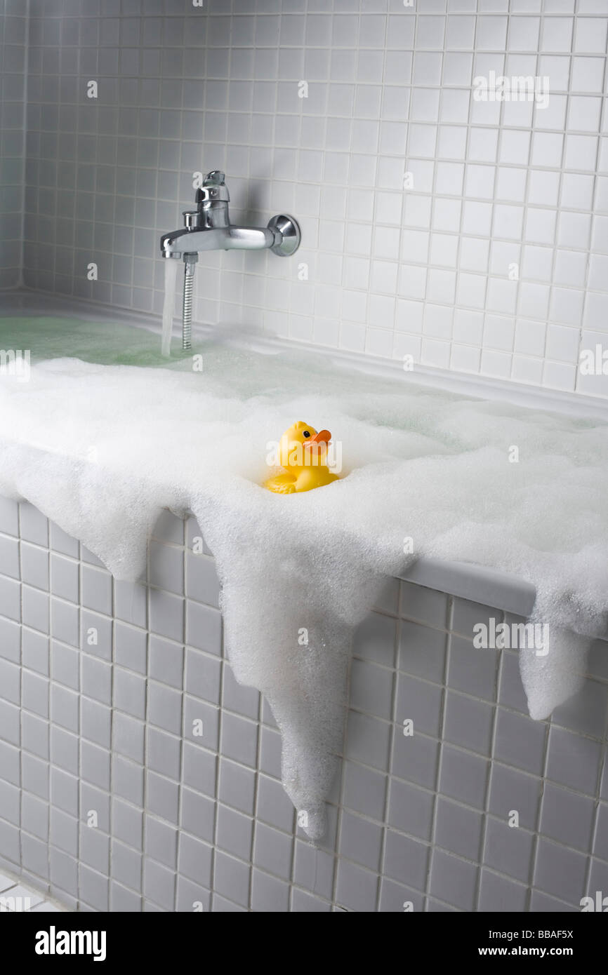 An overflowing bubble bath Stock Photo Alamy