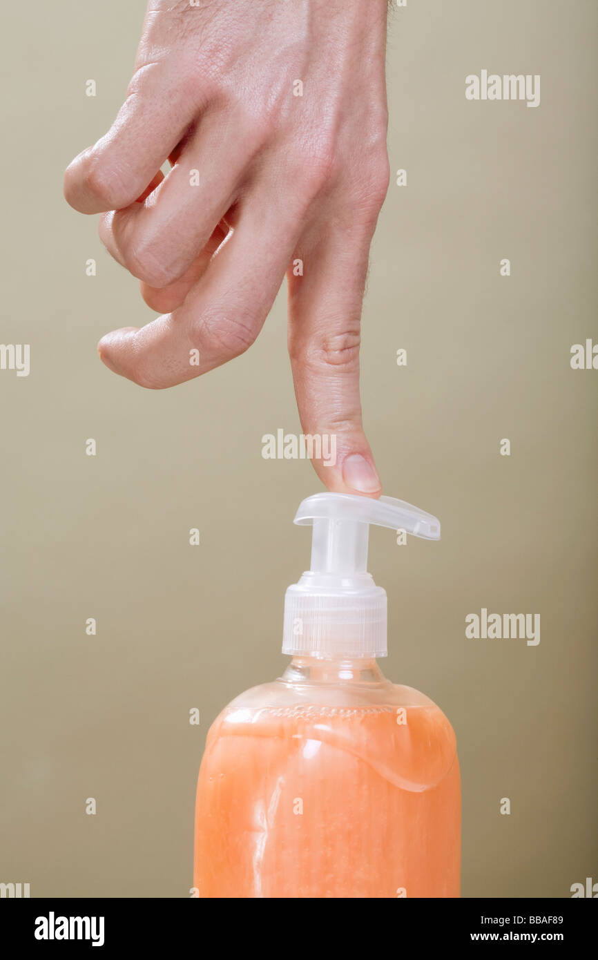 https://c8.alamy.com/comp/BBAF89/a-human-finger-pushing-a-hand-soap-dispenser-BBAF89.jpg