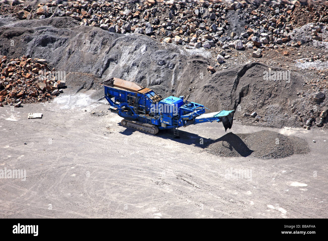 Open cast Quarry rock crusher machine in the hils around Cheddar Valley
