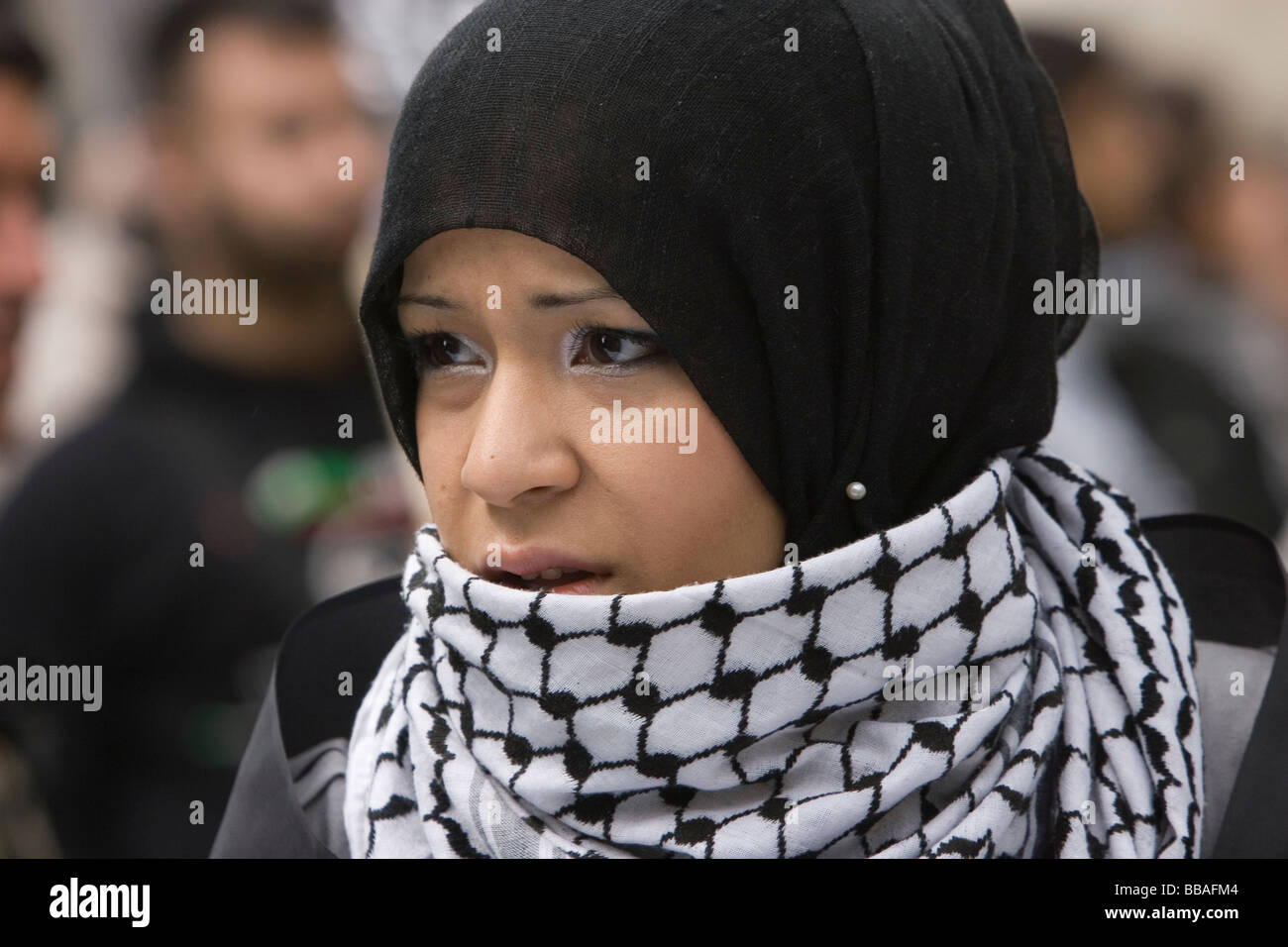 Palestinian protester wearing headscarf and scarf Stock Photo