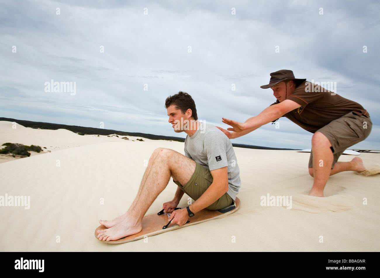 Sand boarding fun on the desert dunes of Little Sahara. Kangaroo Island, South Australia, AUSTRALIA Stock Photo