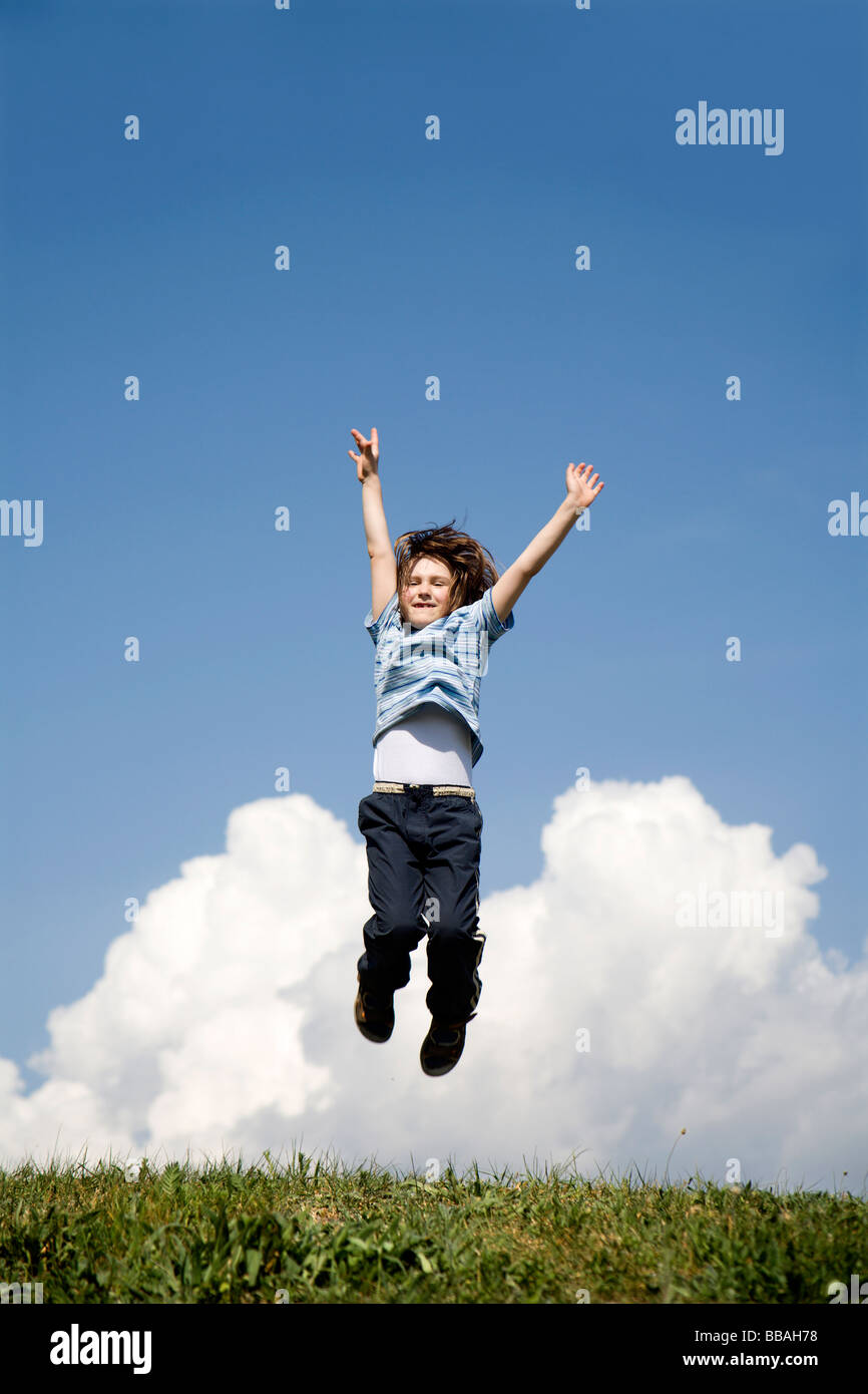 jump of child and the sky - happy Stock Photo