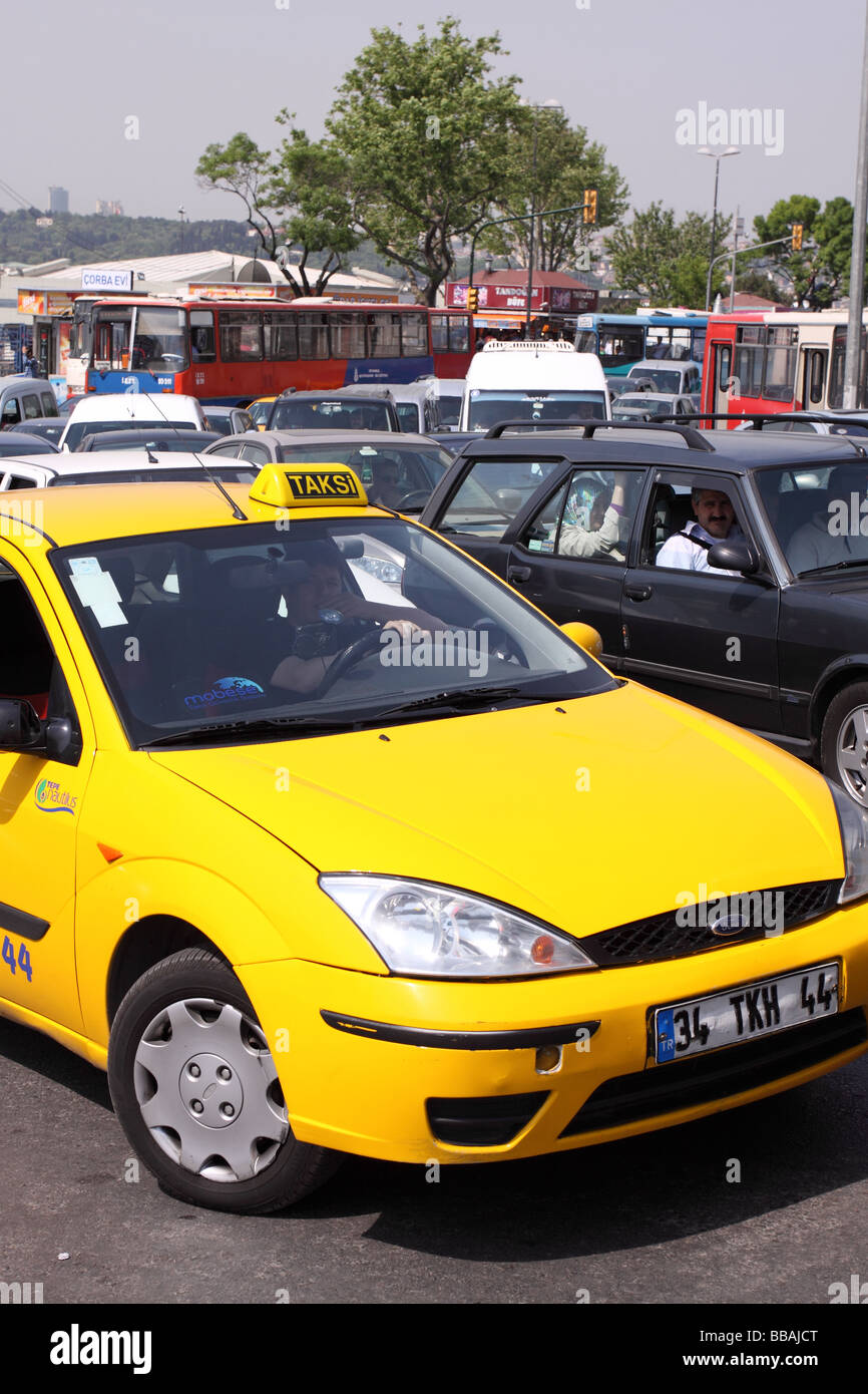 Istanbul Turkey yellow taxi cab taksi stuck in rush hour traffic jam Stock Photo