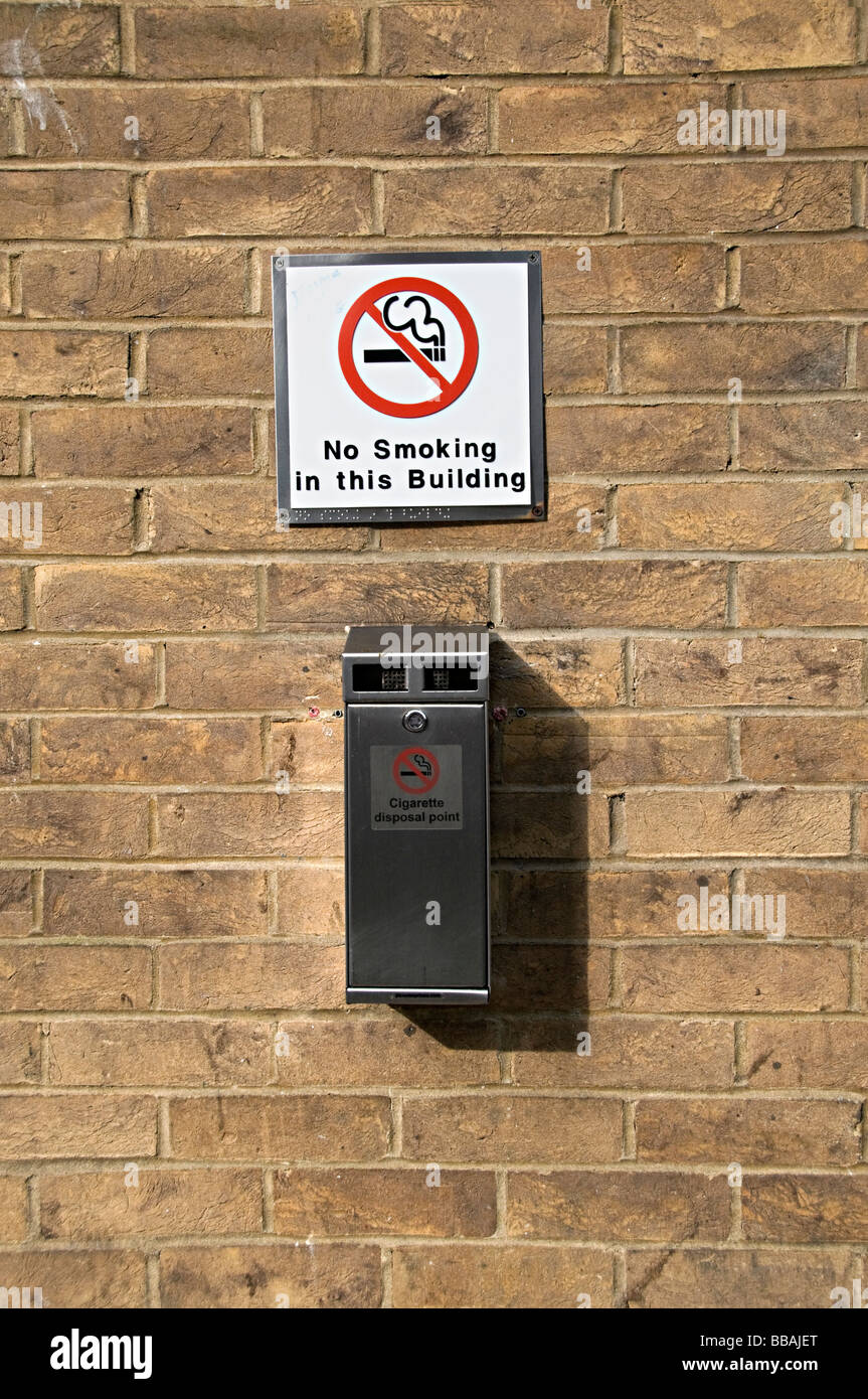 a no smoking sign with ashtray outside a toilet in brighton in the uk Stock Photo