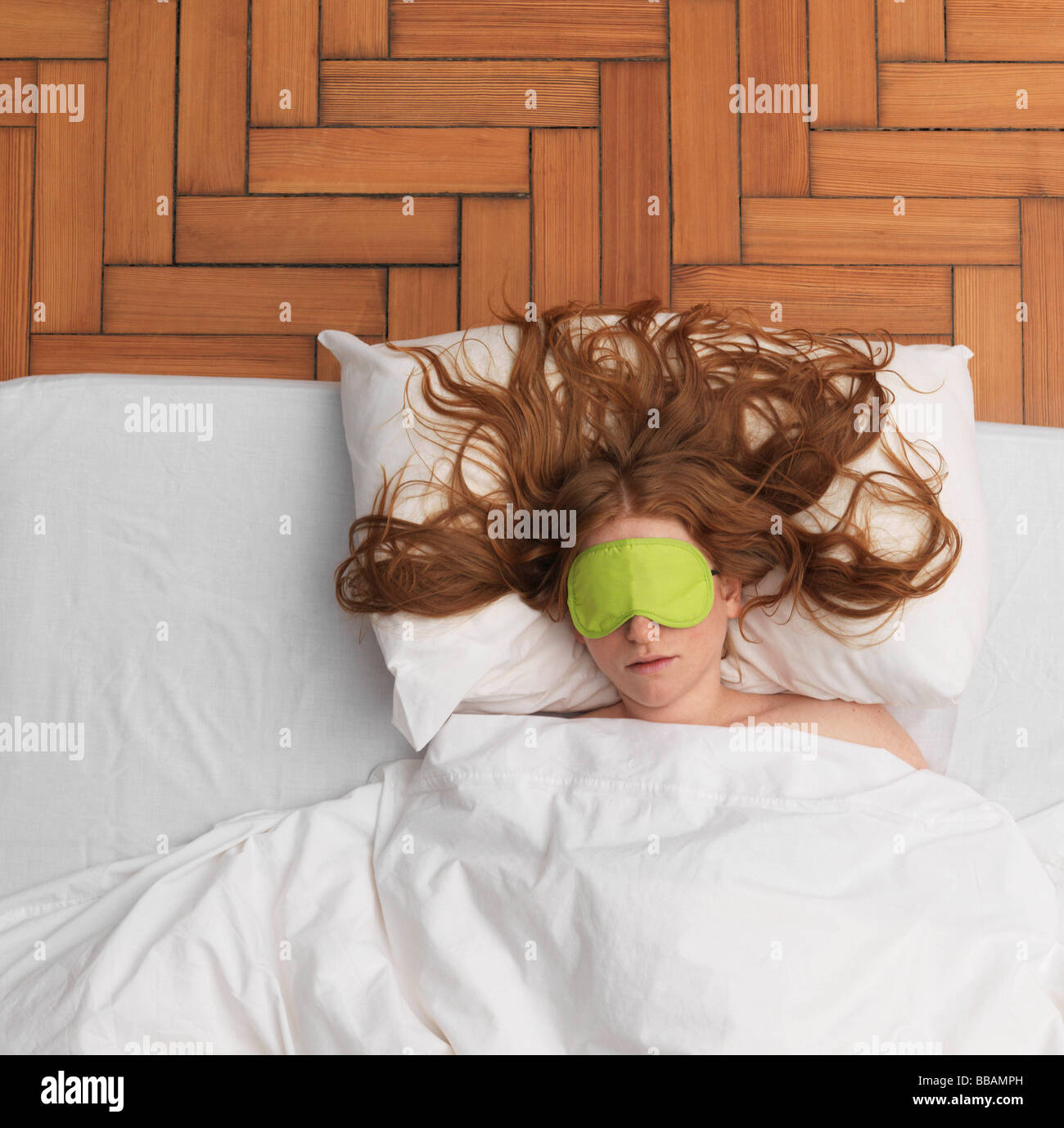 Woman sleeping, wearing eyemask Stock Photo Alamy