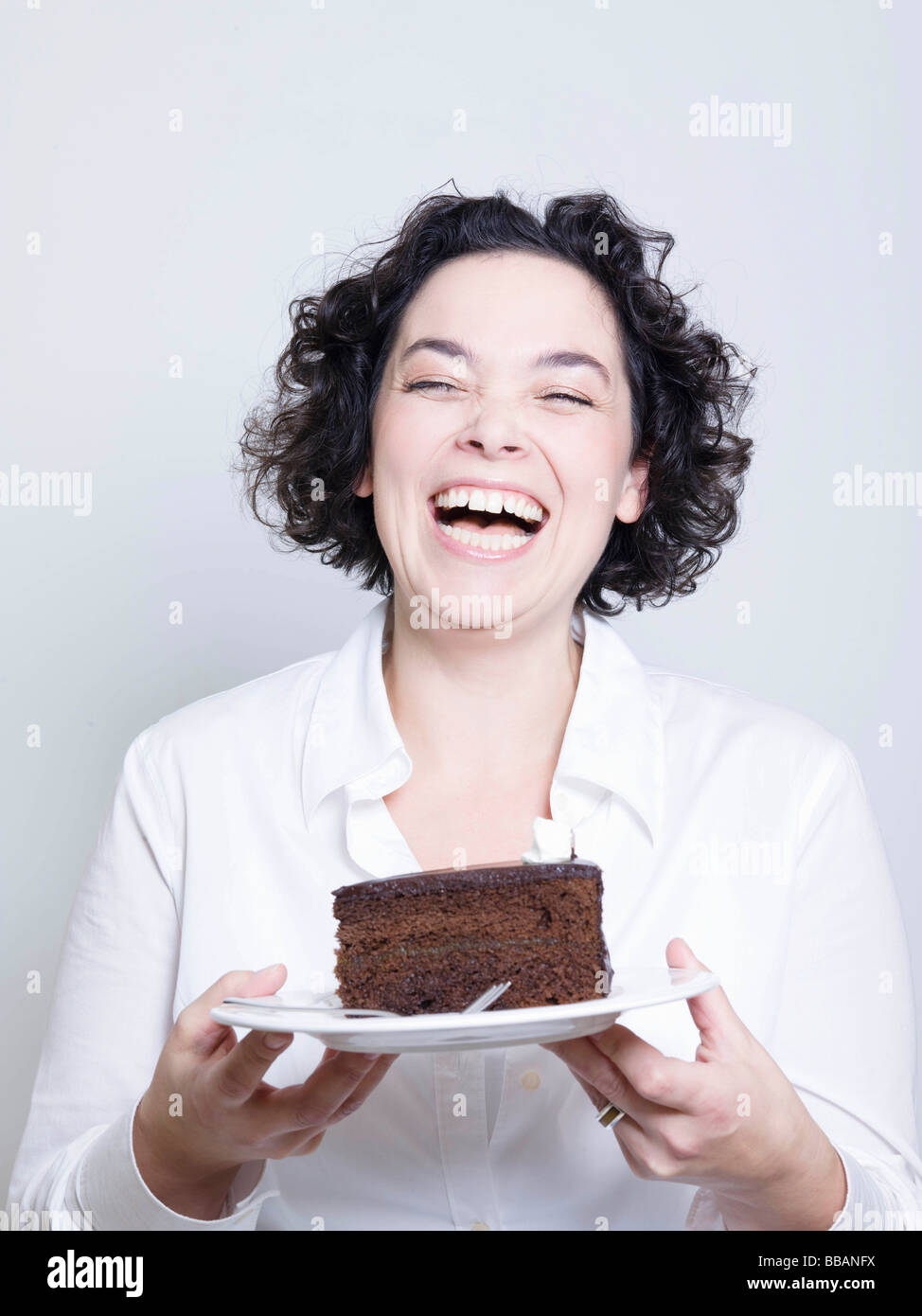 woman holding a plate of cake Stock Photo Alamy
