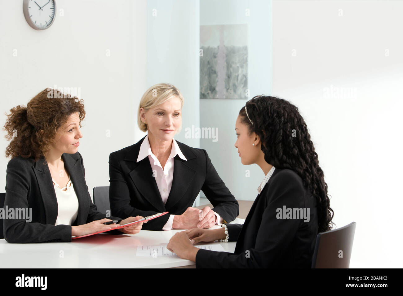 Two business women conduct an interview Stock Photo