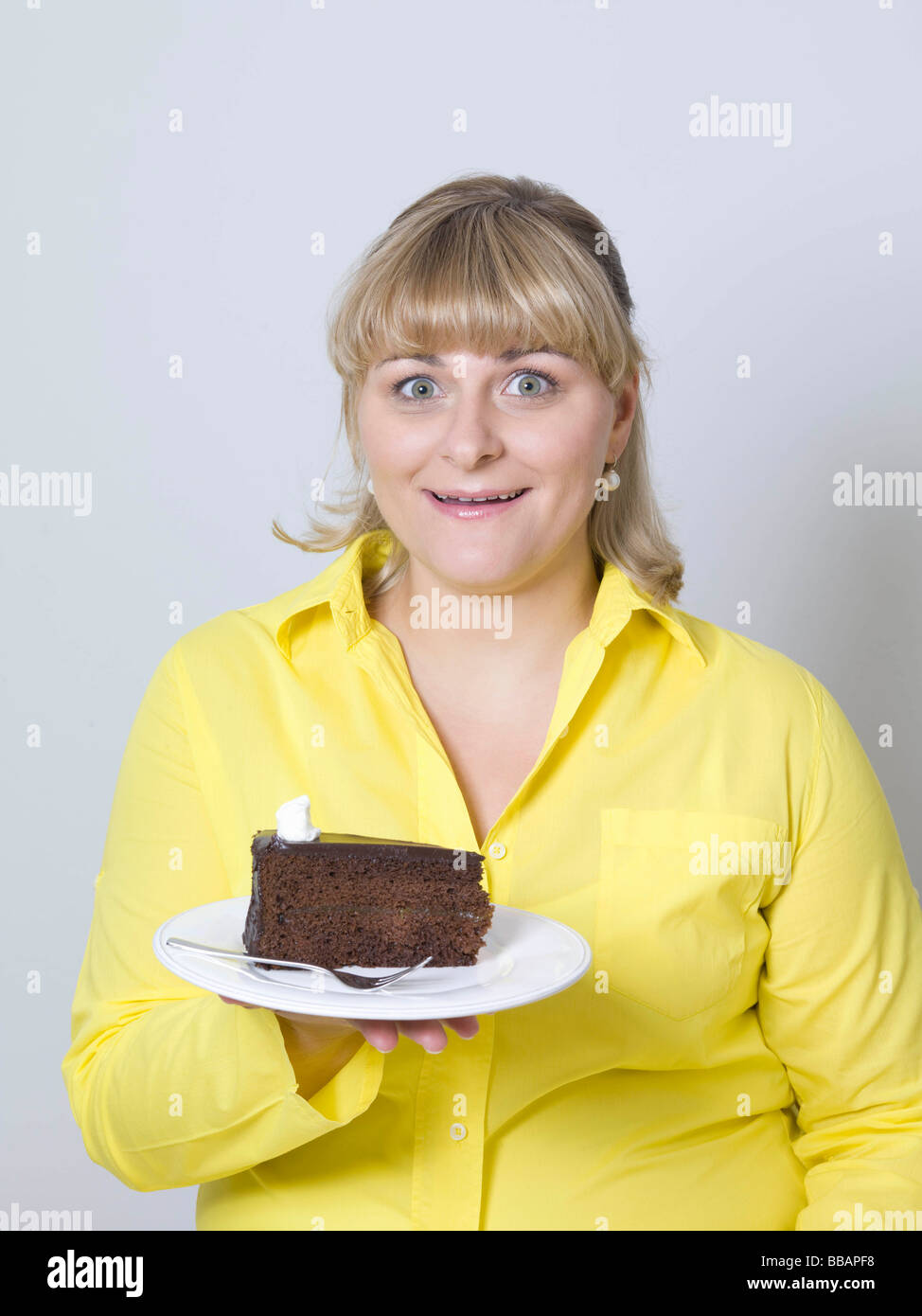 woman holding a plate of cake Stock Photo Alamy