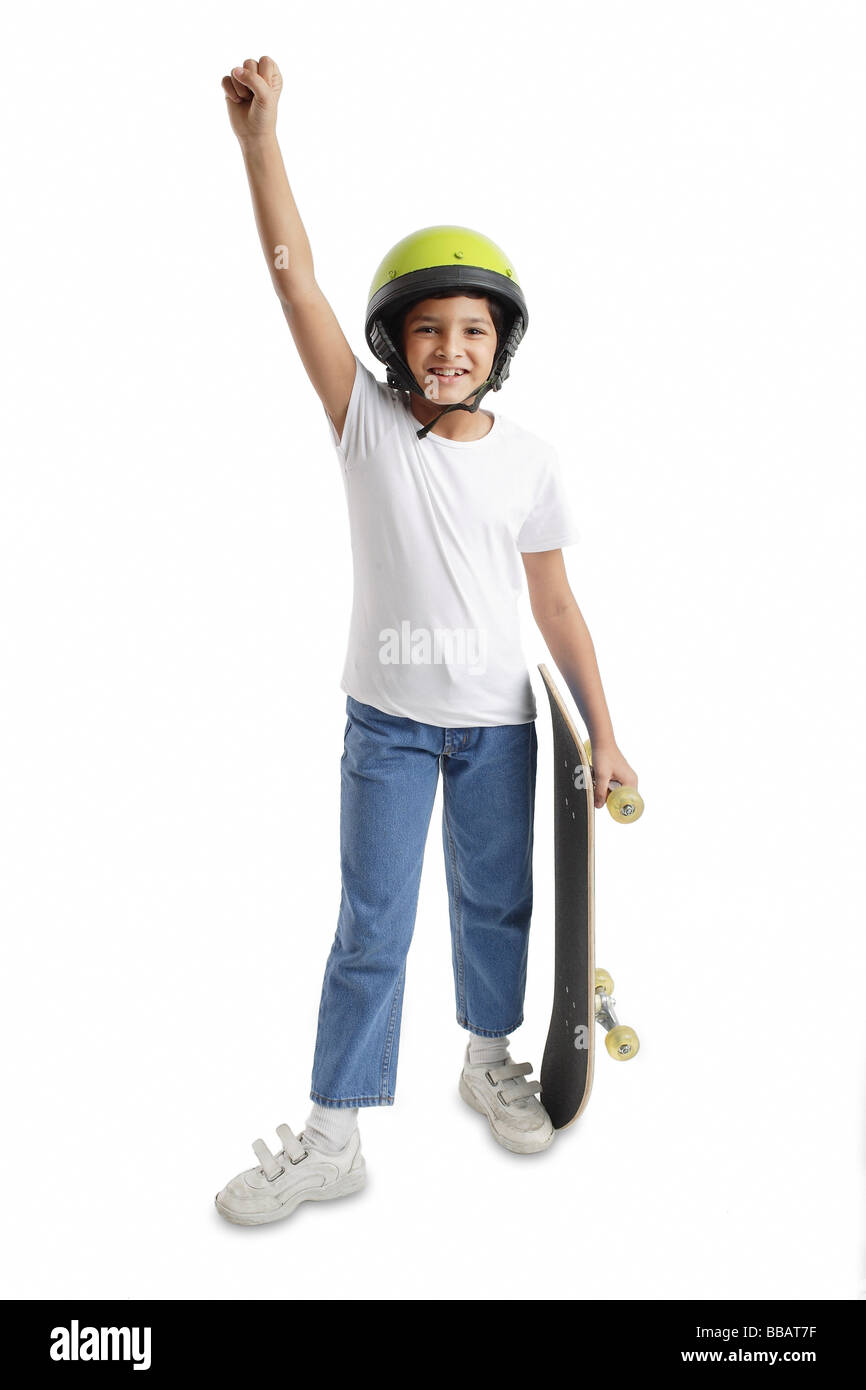 Boy with helmet and skateboard, arm outstretched Stock Photo Alamy