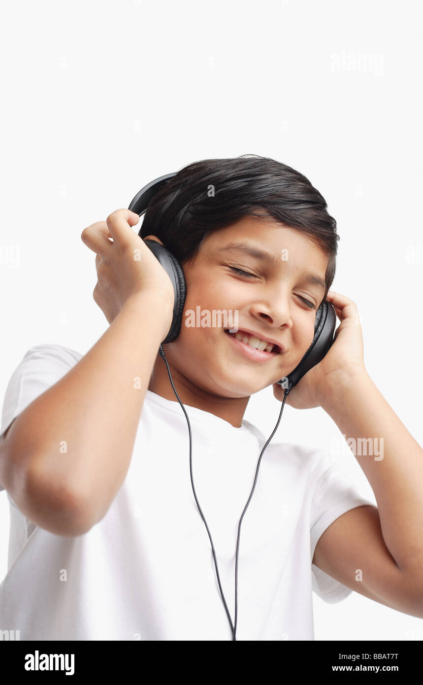 Boy wearing headphones, eyes closed Stock Photo - Alamy