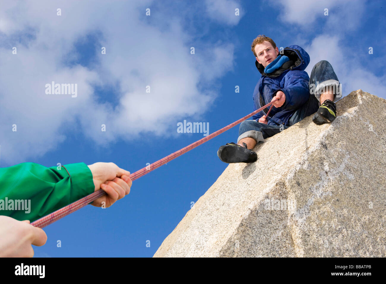 Climber belaying fellow climber Stock Photo Alamy