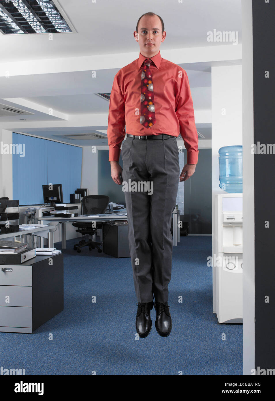 Office worker suspended in mid air Stock Photo