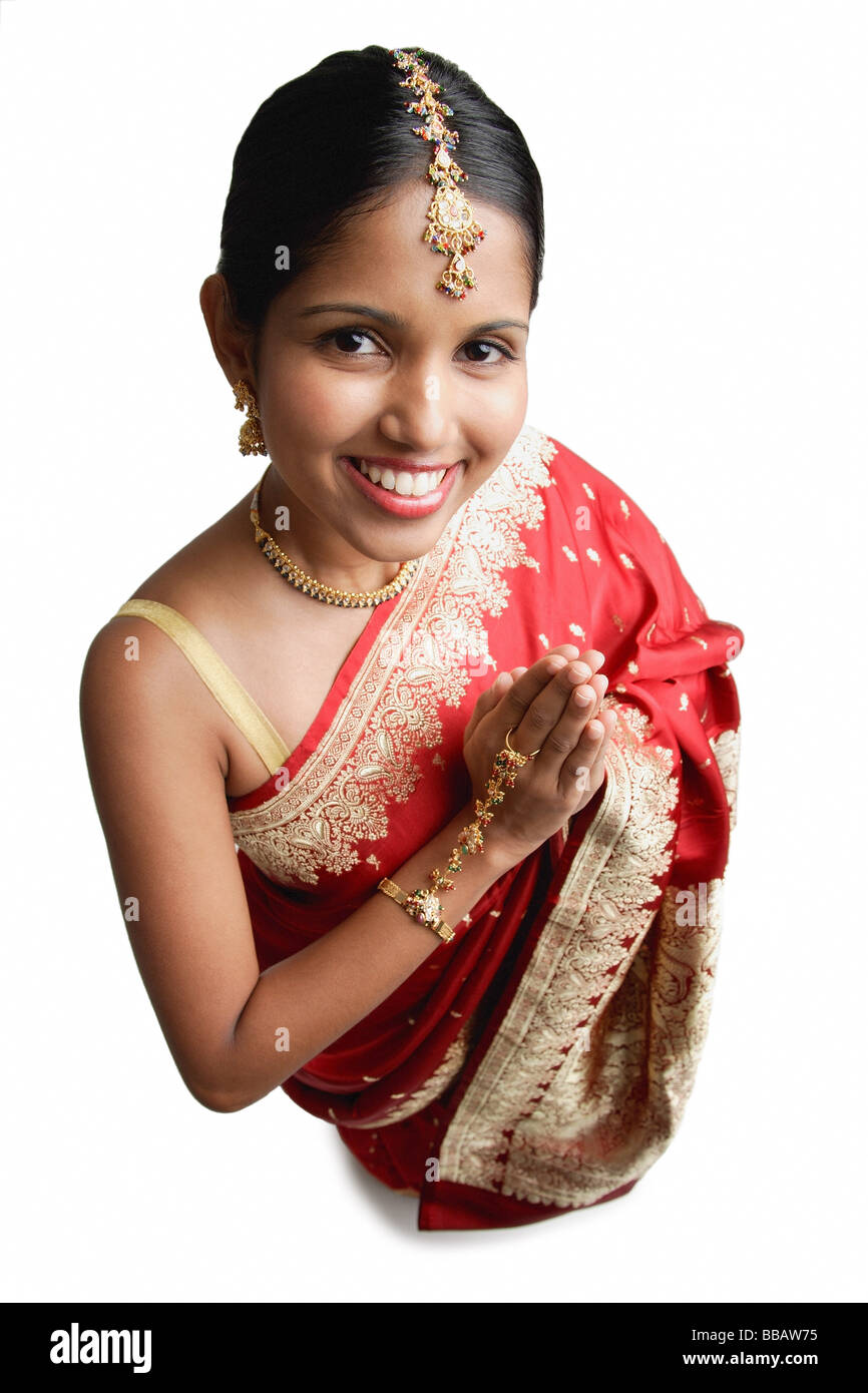 Indian woman praying Cut Out Stock Images & Pictures - Alamy