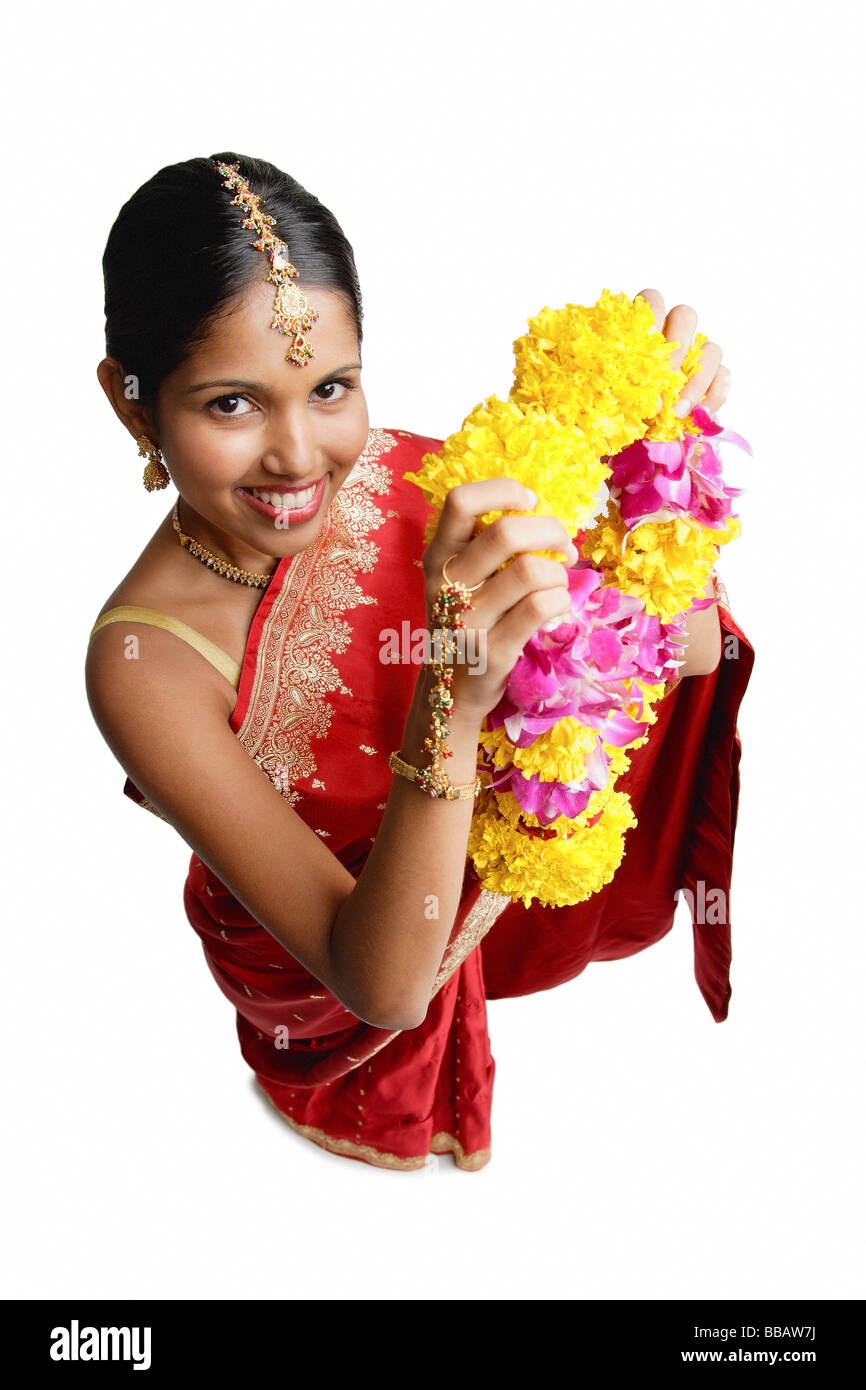 Indian woman flowers hair Cut Out Stock Images & Pictures - Alamy
