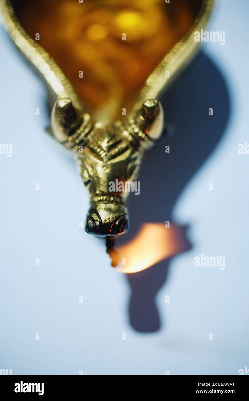 Still life of oil lamp with animal detailing Stock Photo
