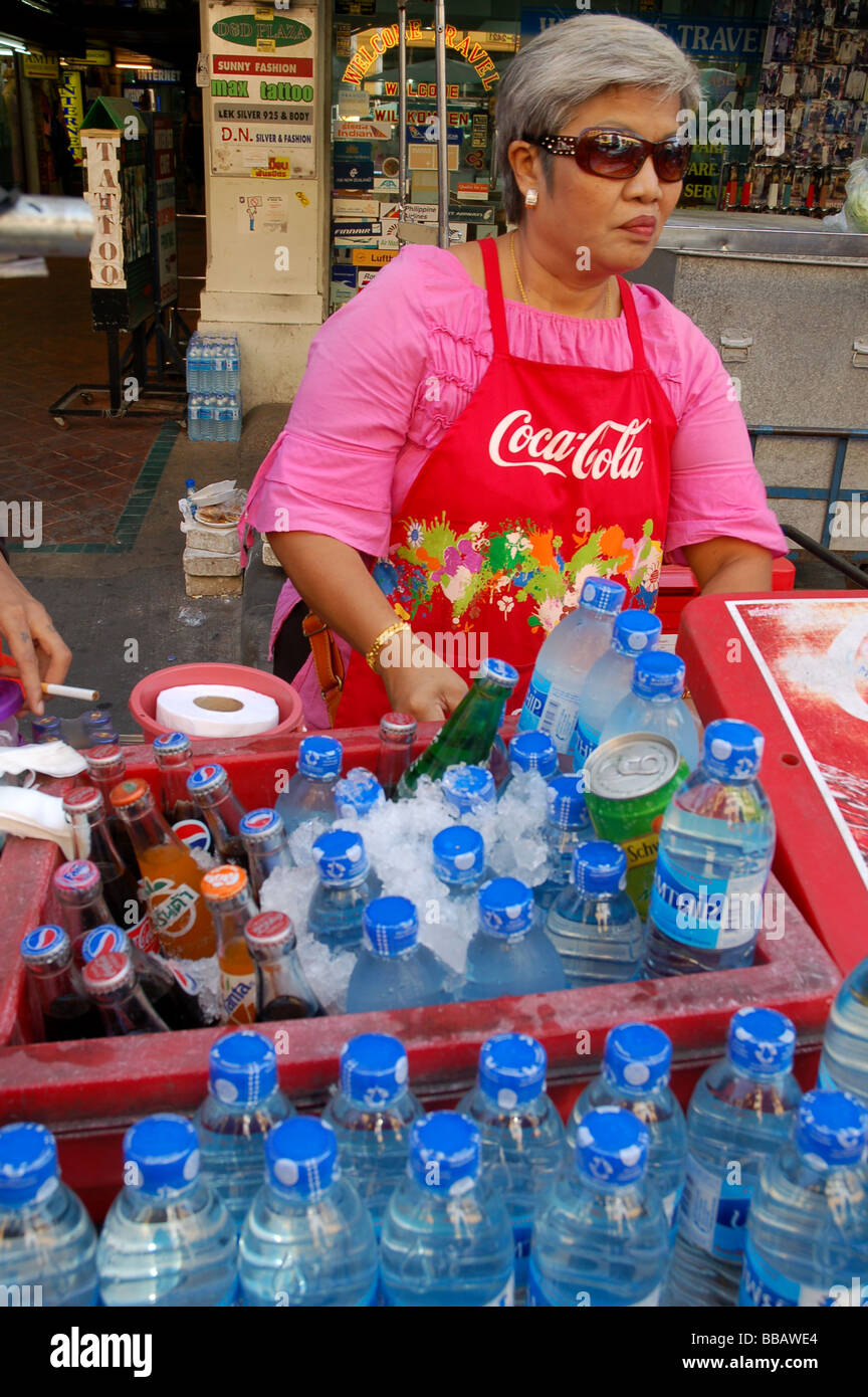 Thai lady selling bottles of water in Khao San Road, Bangkok, THAILAND