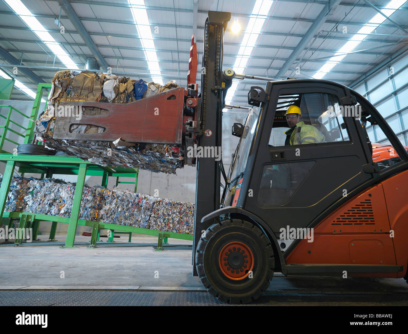 Forklift Truck In Recycle Plant Stock Photo