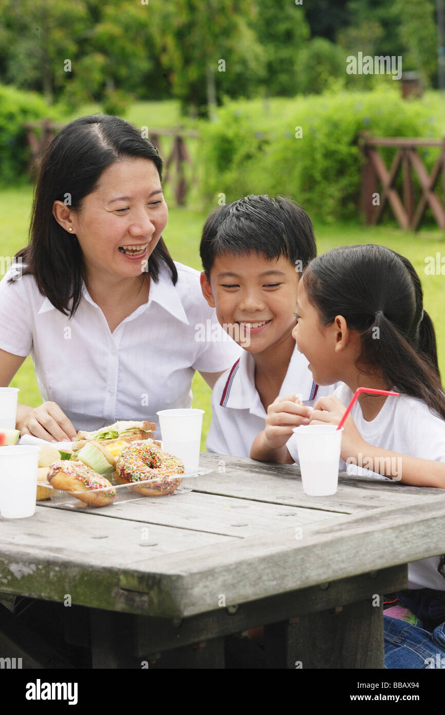 Asian family picnic table in park hi-res stock photography and images ...