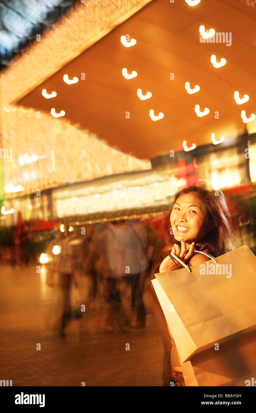 Young woman, carrying shopping bag over shoulder Stock Photo Alamy