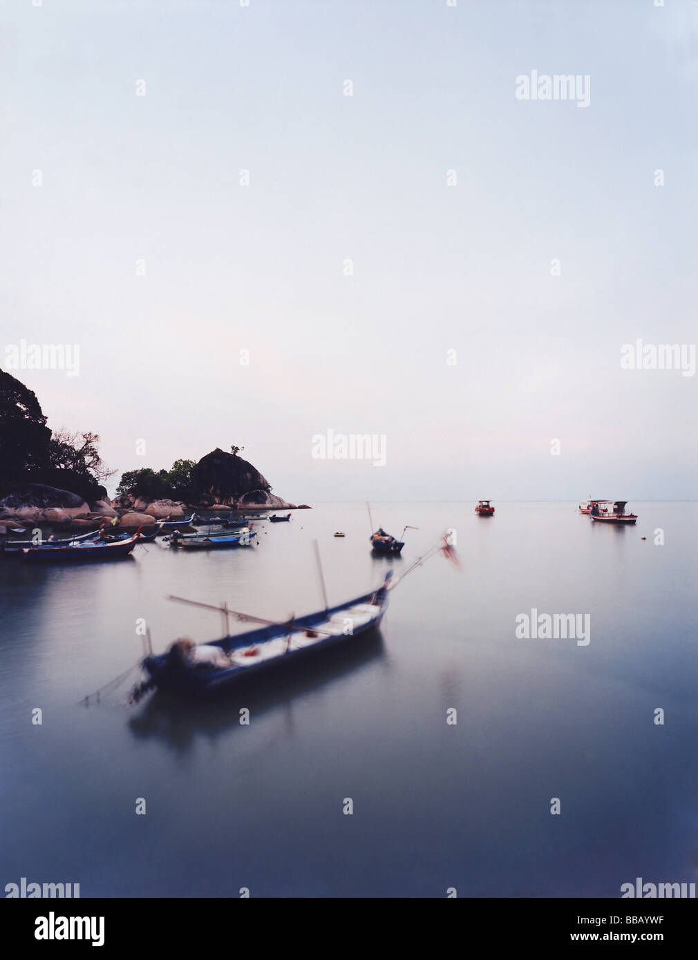 Fishing boats at sundown Stock Photo - Alamy