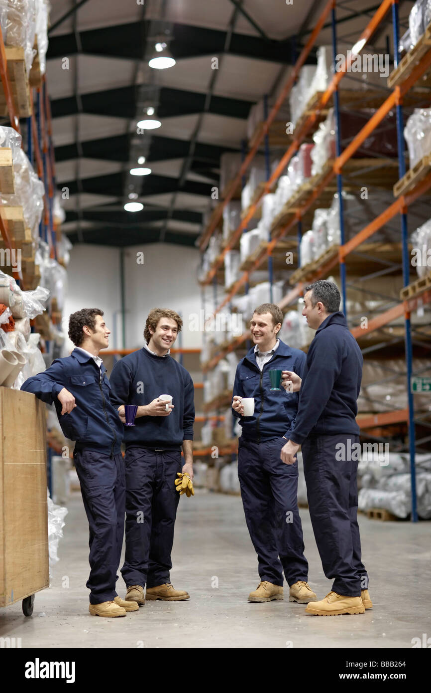 Workers in warehouse having break Stock Photo Alamy