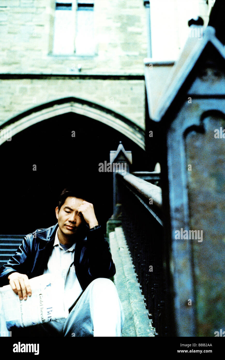 Man sitting on steps stairs hi-res stock photography and images - Alamy