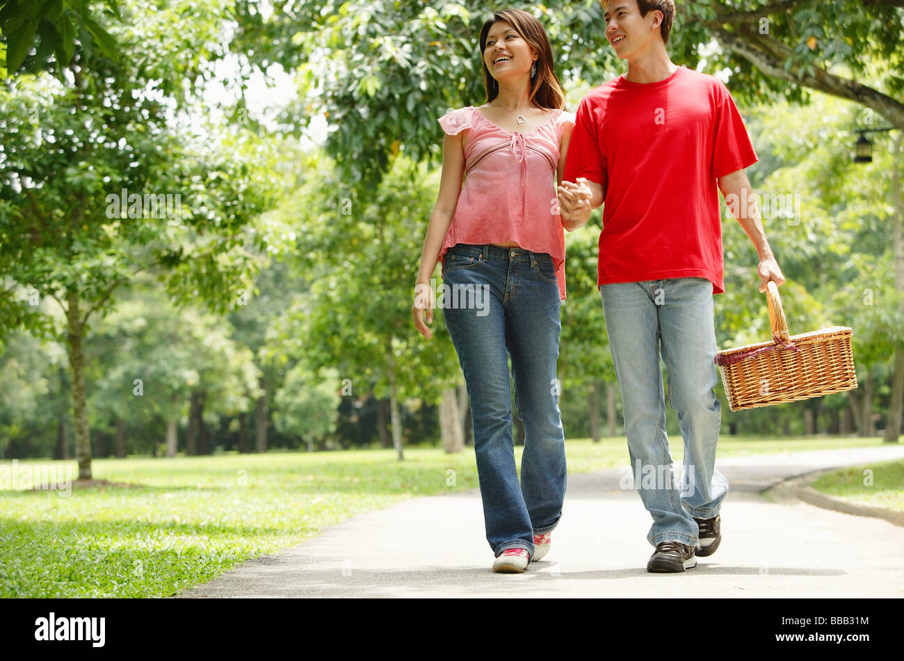 Couple walking holding hands hi-res stock photography and images - Alamy