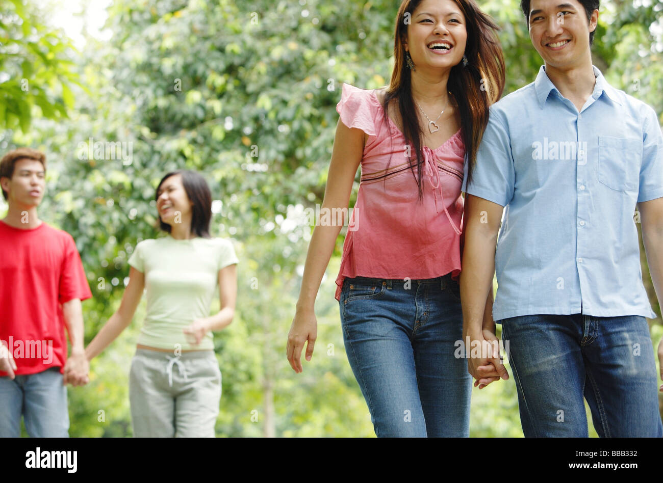 Couples walking in park hi-res stock photography and images - Alamy