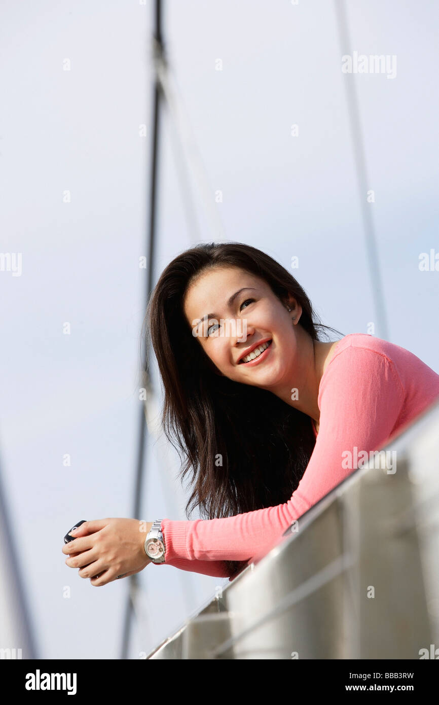 Woman looking over bridge hi-res stock photography and images - Alamy