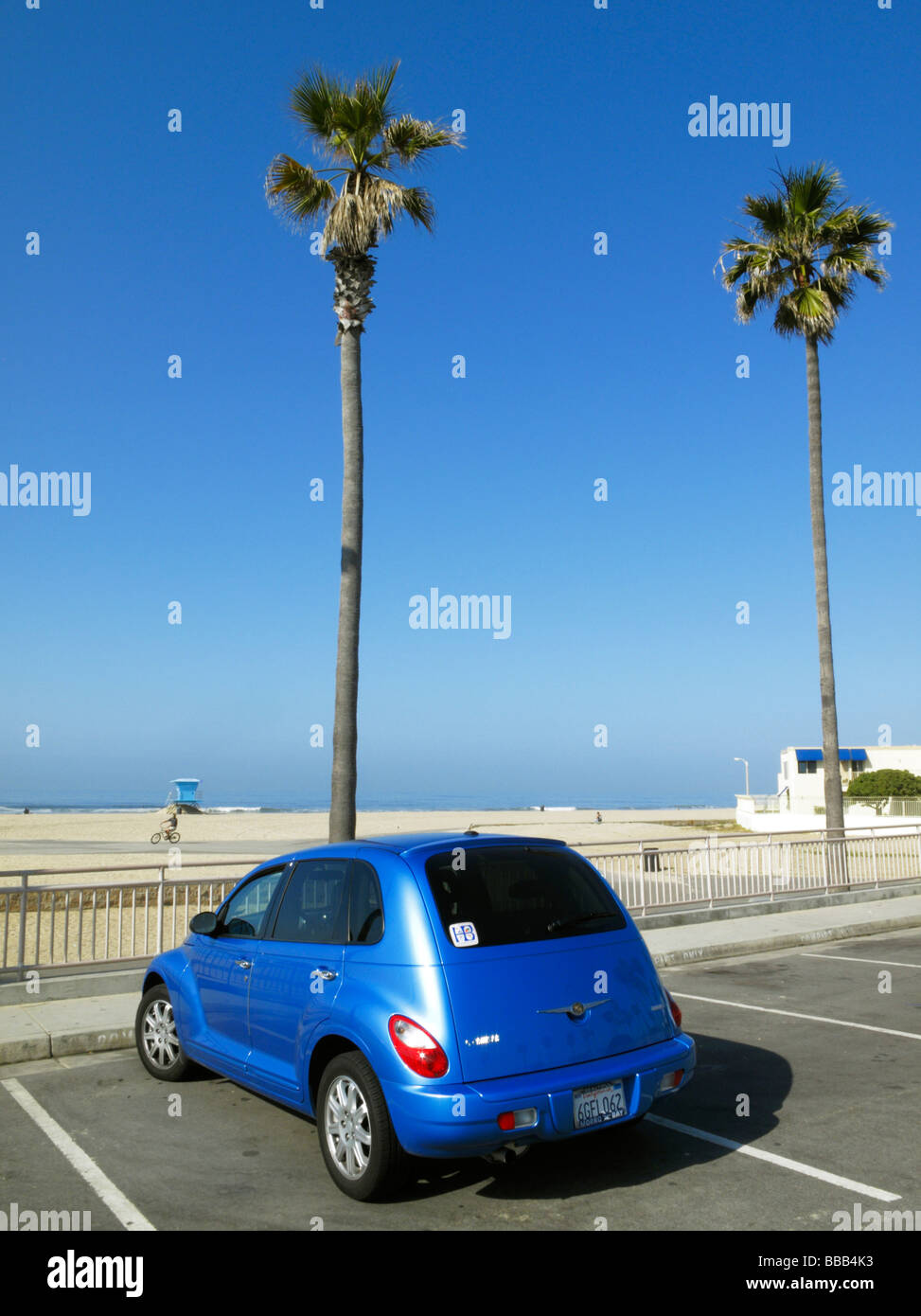 A metallic blue PT Cruiser at the ocean front, Huntington Beach CA Stock Photo