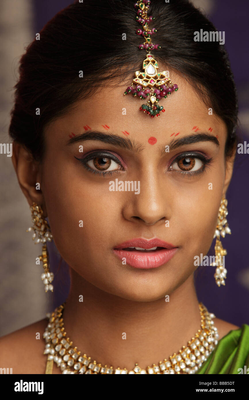 woman decorated with henna tattoos, jewelry and bindi Stock Photo