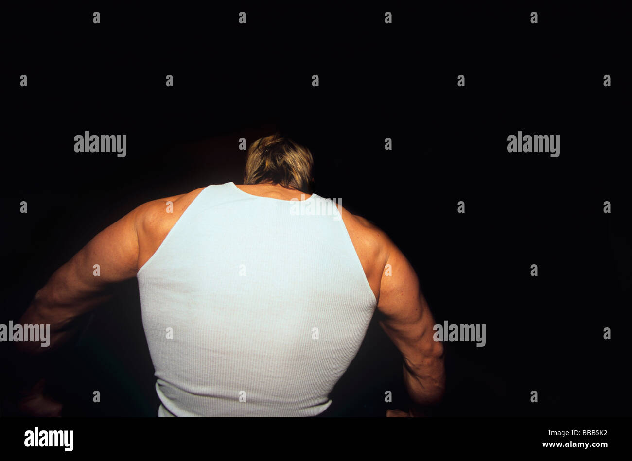 Body builder exercises vigorously  Stock Photo