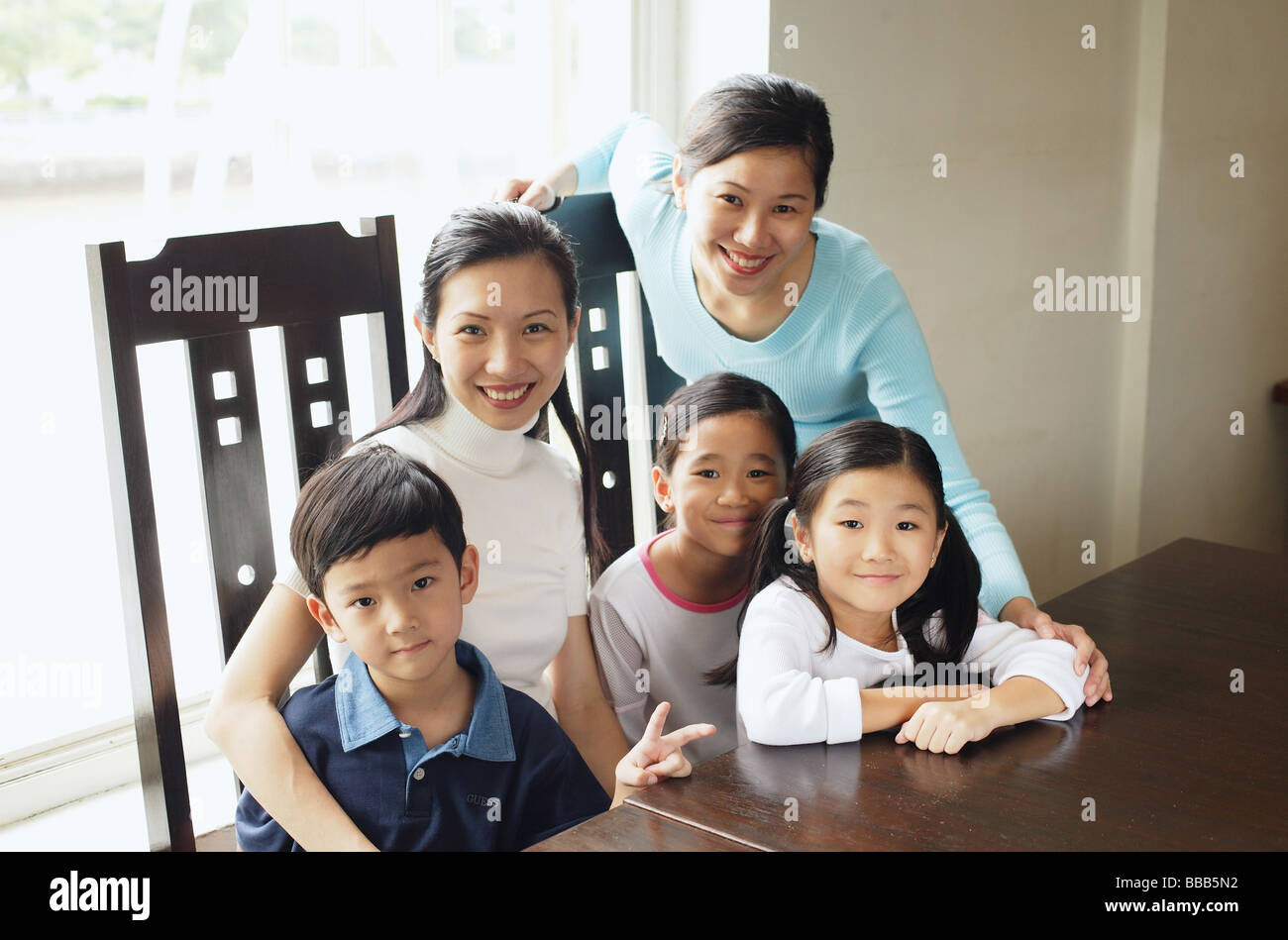 Mothers with children, looking at camera Stock Photo